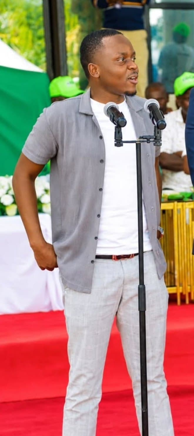 Leon addressing a gathering at the microphone